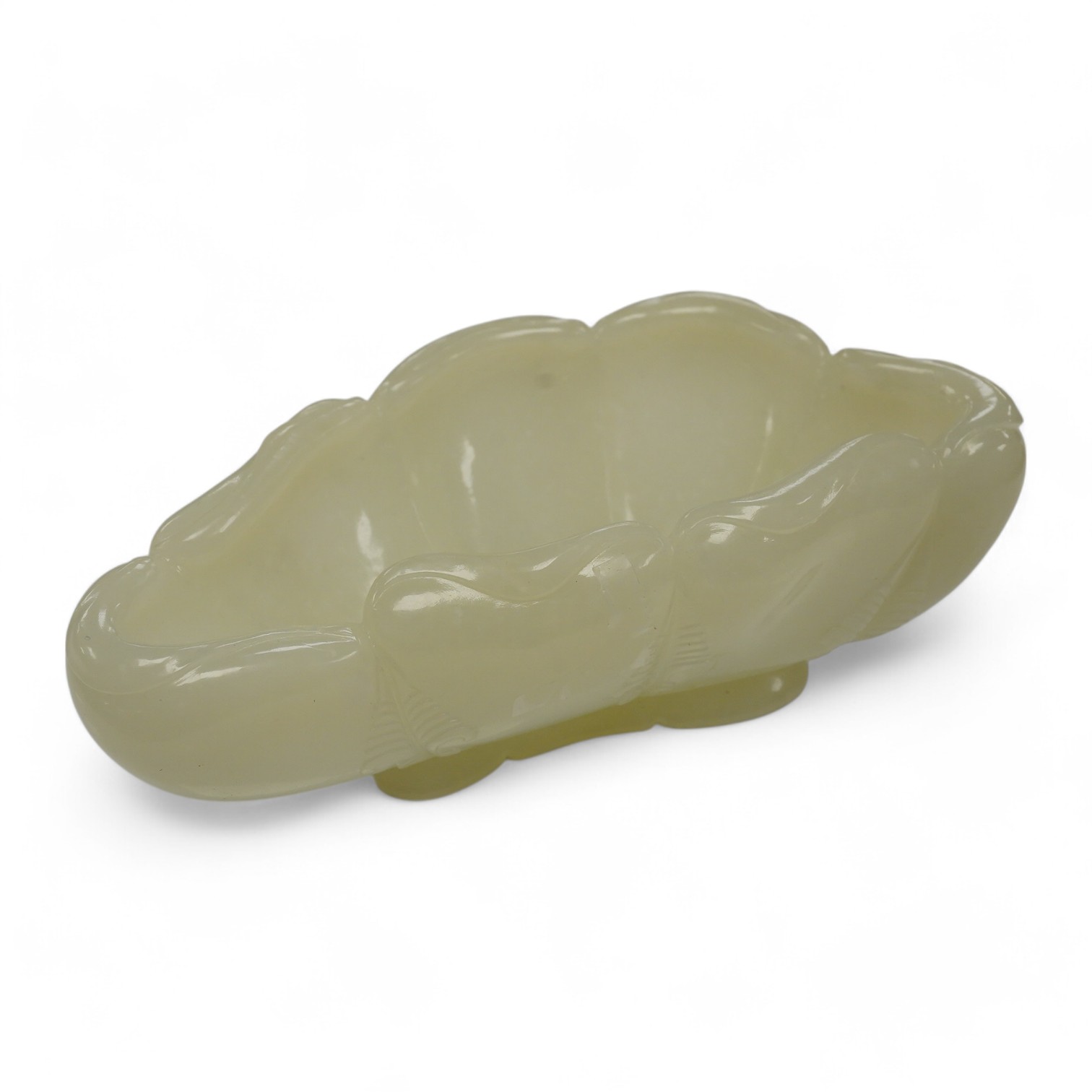 A Chinese jade ‘lotus’ shaped brush washer, 13cm wide. Condition - good